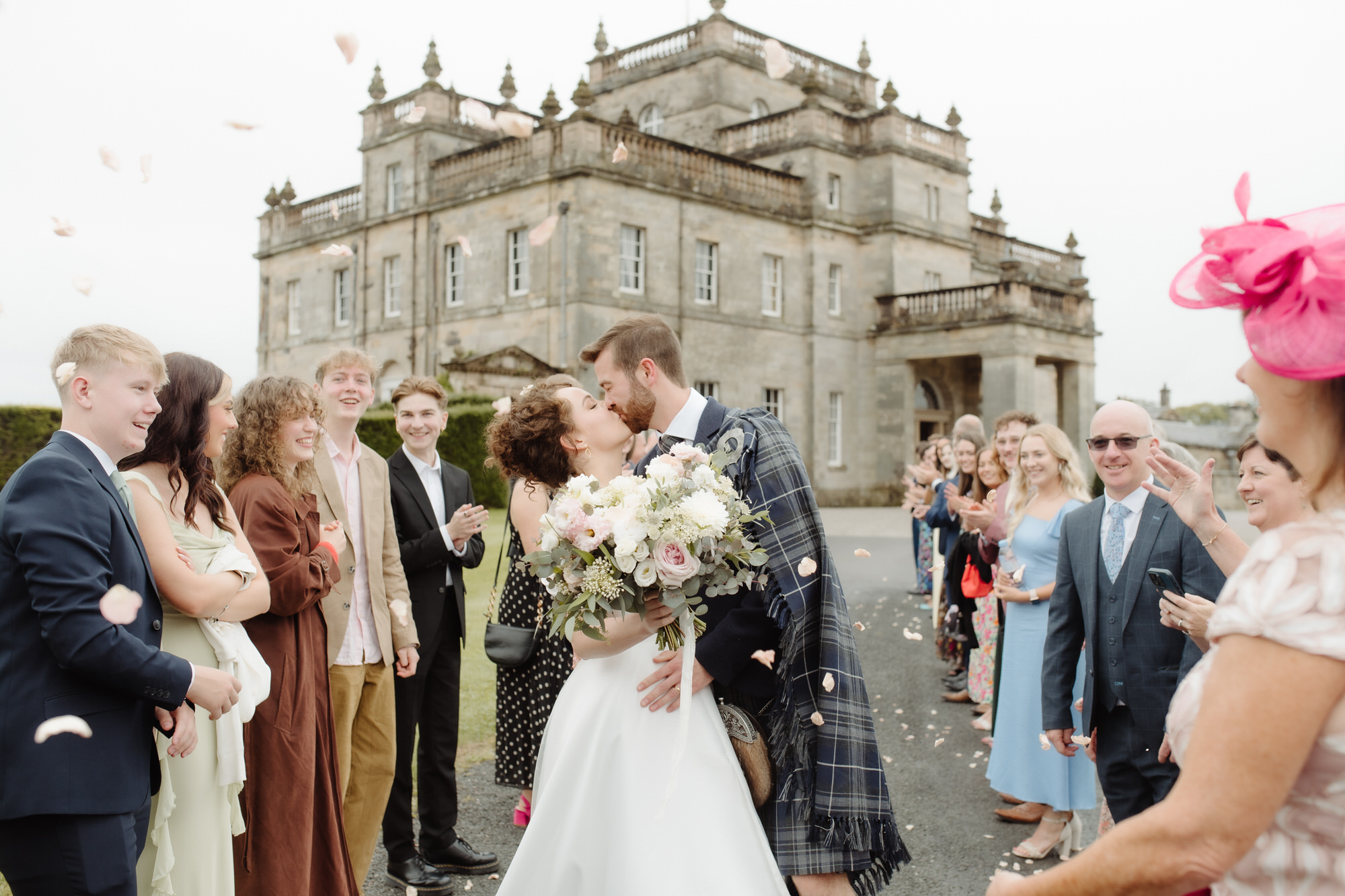 Confetti throw with Kinmount house in the background at Kinmount House wedding