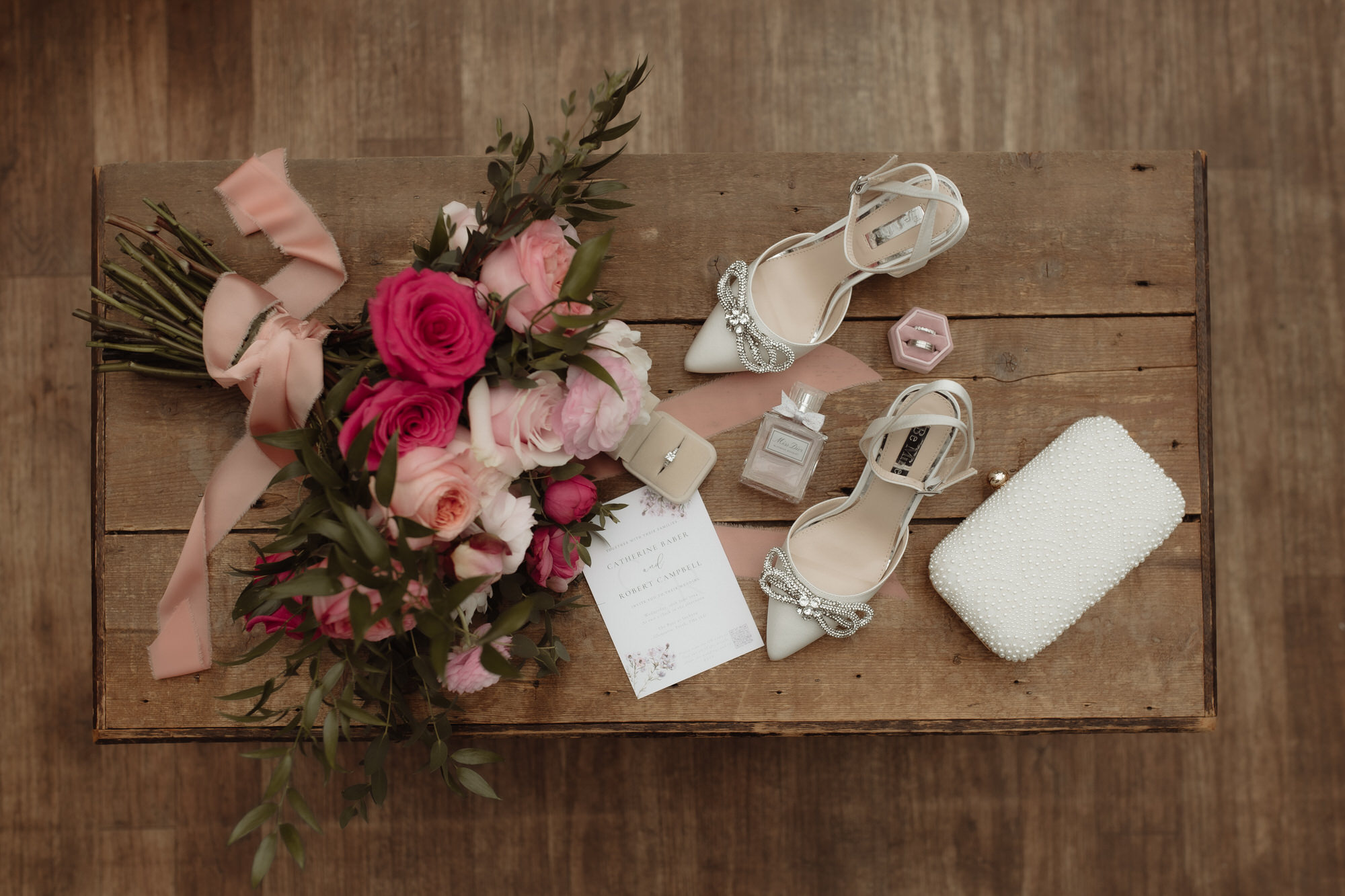 Wedding shoes and flowers on a table at The Byre at Inchyra.