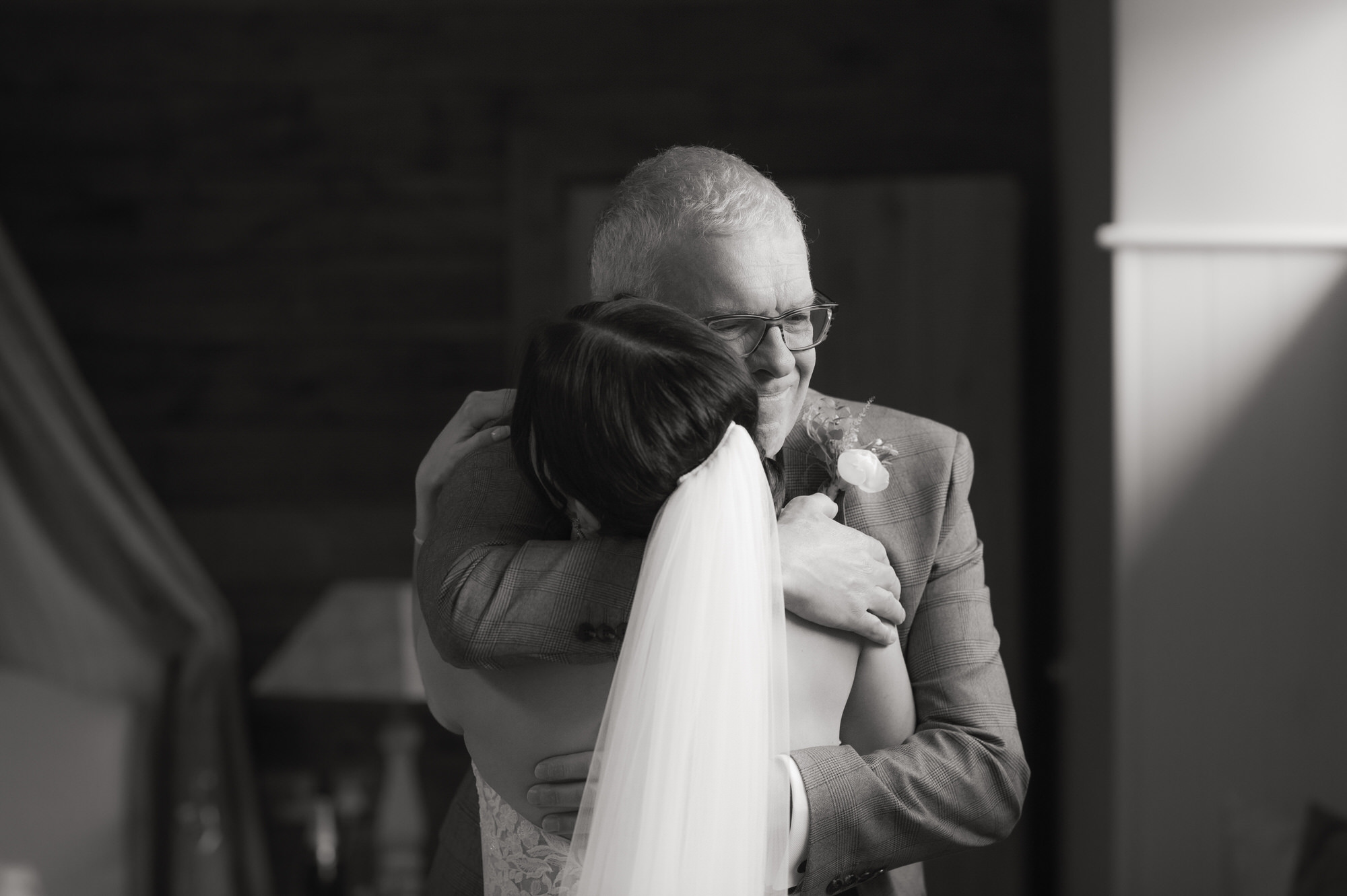 Dad hugs his daughter at her wedding at the Byre at Inchyra.