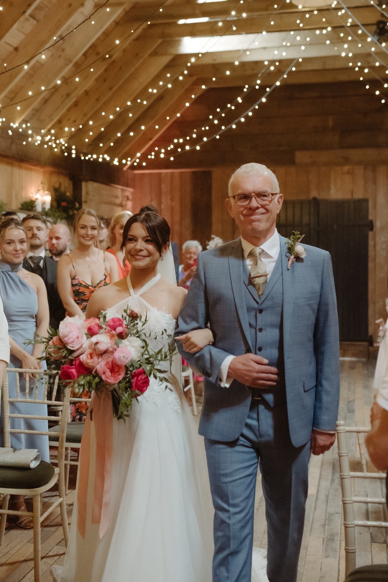 Bride and her father walk down the aisle at the Byre at Inchyra.