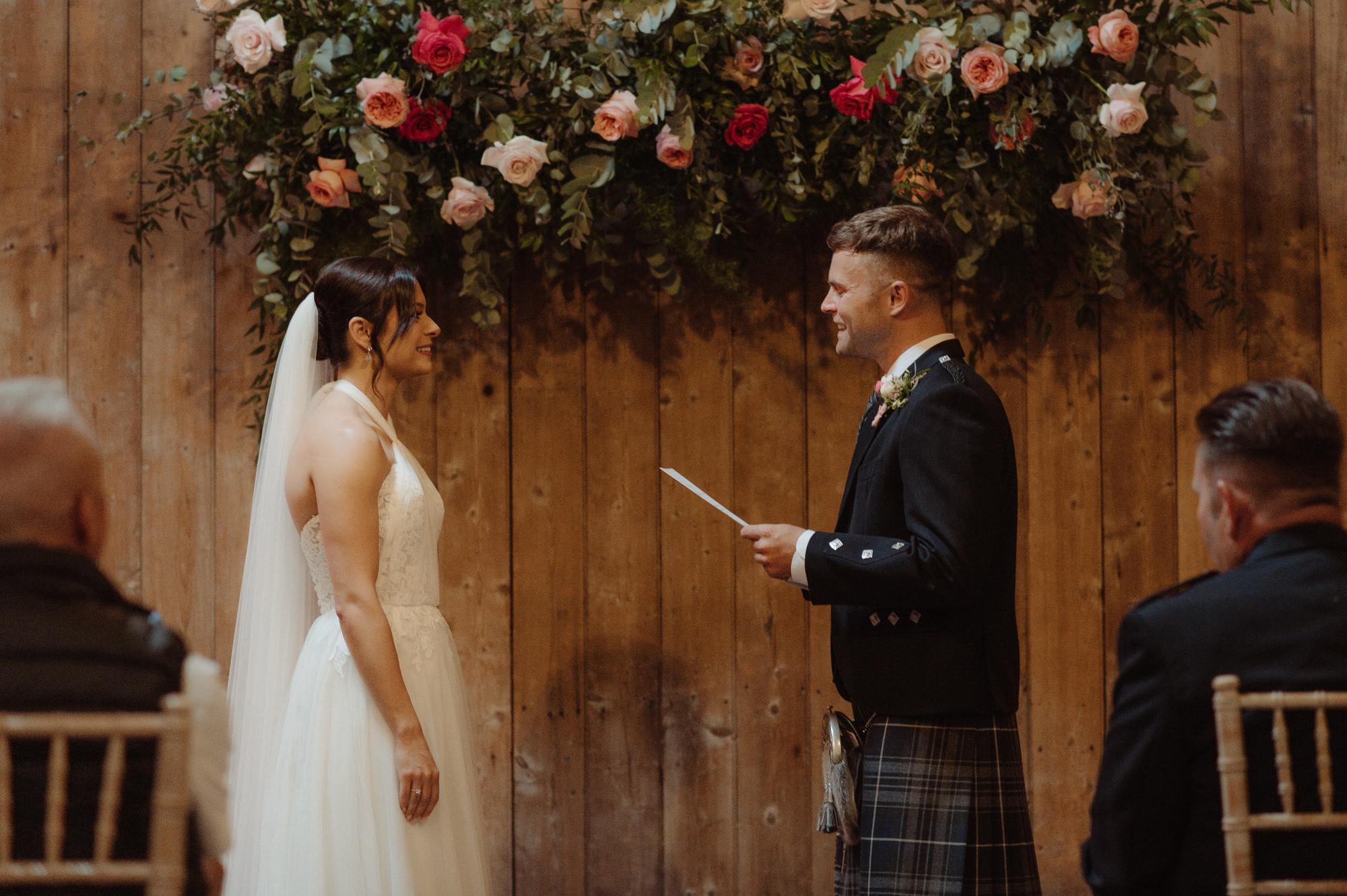 Couple face eachother to say their vows at the Byre at Inchyra.