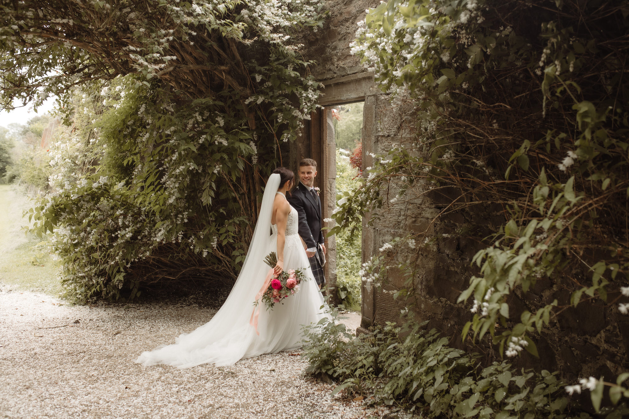 Bride and Groom enter through the walled garden door at the Byre at Inchyra.