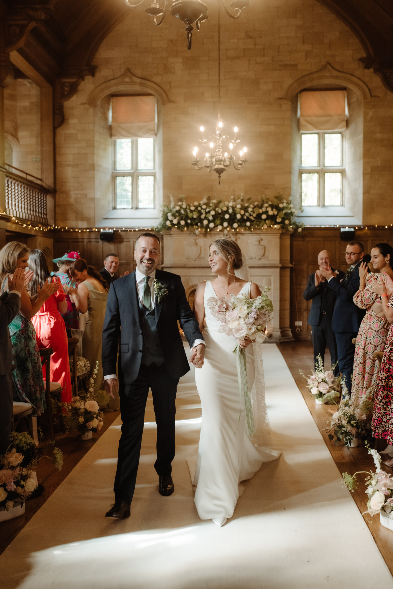 Bride and Groom return down the aisle together at Achnagairn Castle.