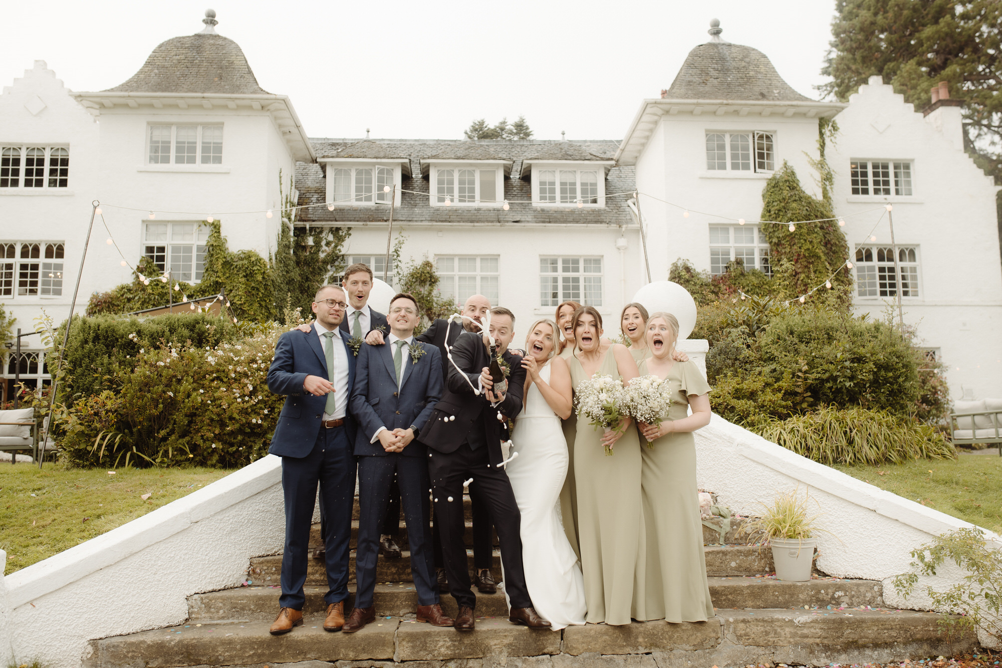 Champagne pop on steps at Achnagairn Castle.