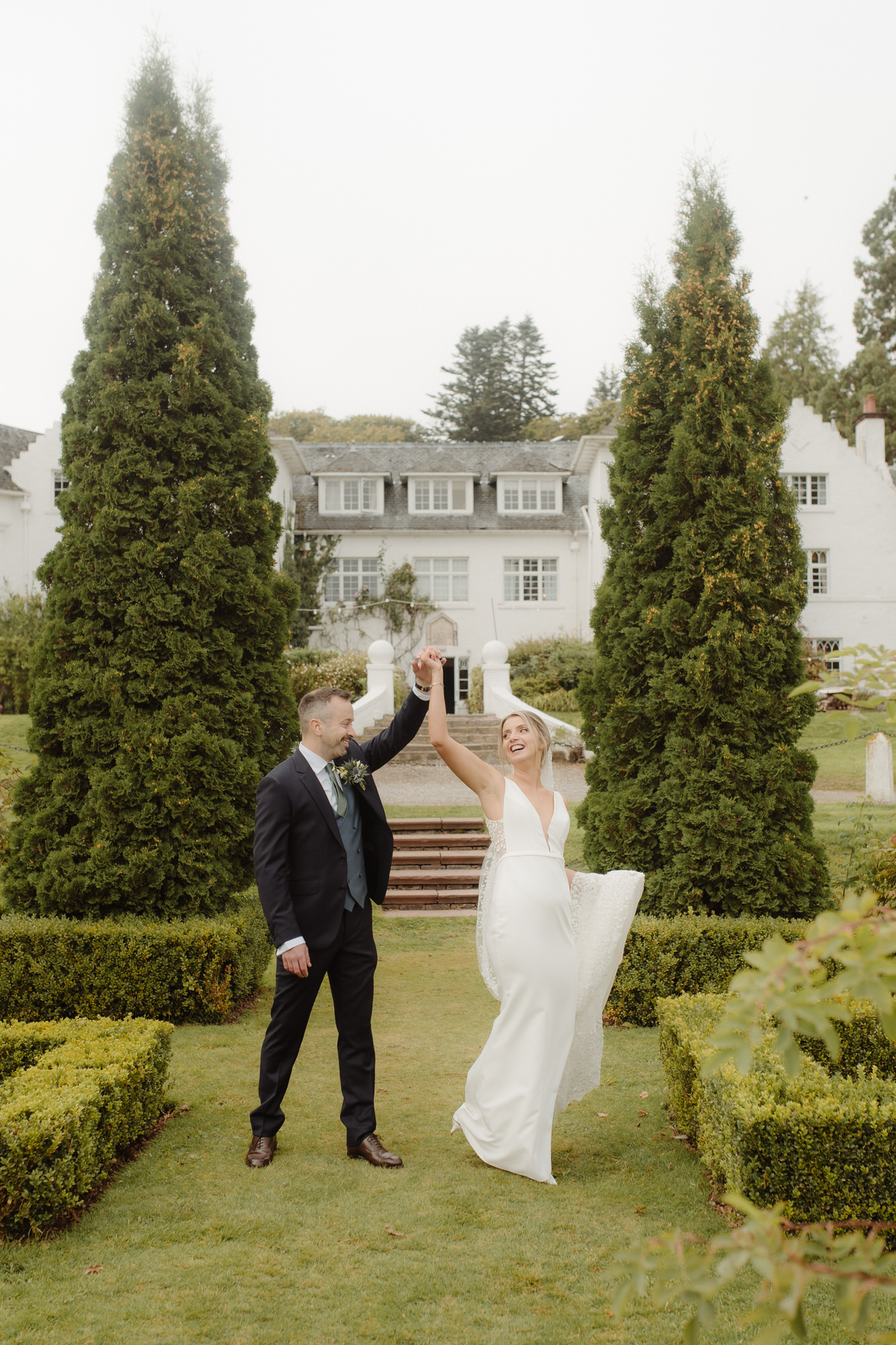 Bride and Groom dance together on the lawn at Achnagairn Castle.