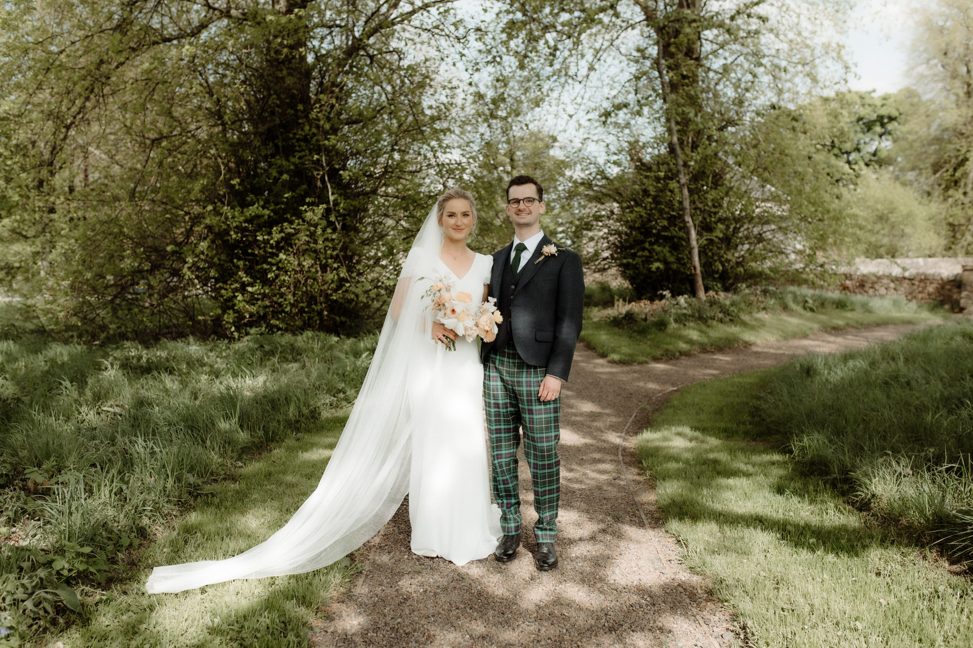 Bride and Groom portrait in the sunshine at Rosebery Steading wedding venue.