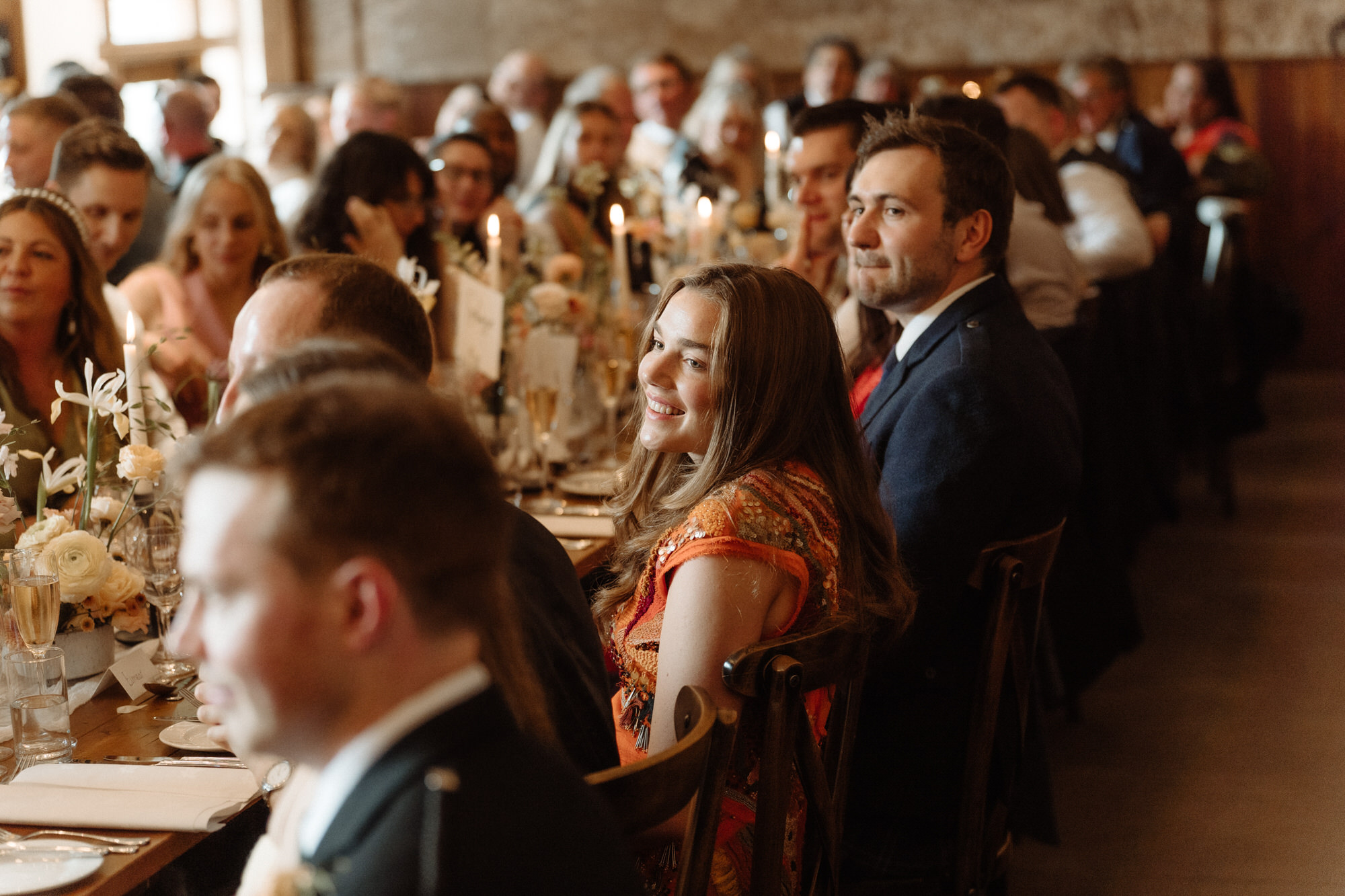 Guests enjoy wedding meal.