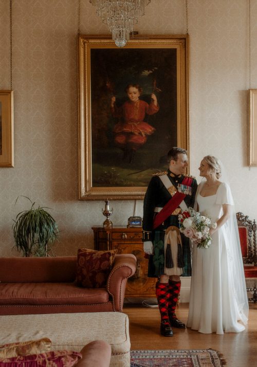 Bride and Groom stand together in the drawing room at Errol Park.